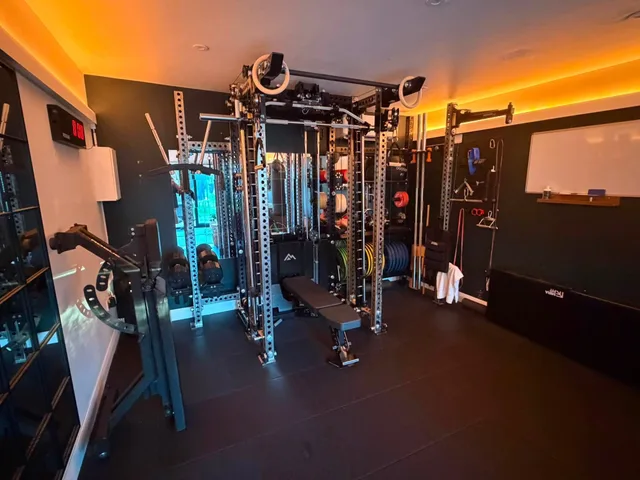 Rob’s current gym with a REP Ares rack and open floor space